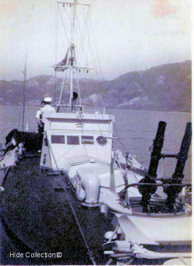 John (Jix) Prest on board MTB 07 alongside HMS Robin in Mirs Bay 1941.    
    Photo from Buddy Hide's collection ©