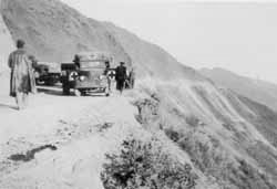 The Red Cross trucks high on the Burma Road above the Salween river Feb 1942. 
    Photo from the Ashby family collection ©