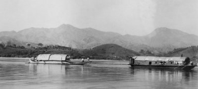 MHB (Walla-Walla to the locals)towing a Sampan up the East River ; 
  Photo from Ron Ashby's collection ©