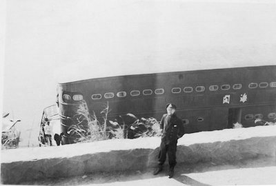 Lt Alex Kennedy by the Sea Palace at Kukong in Jan 1942.     
    Photo from Ron Ashby's collection ©